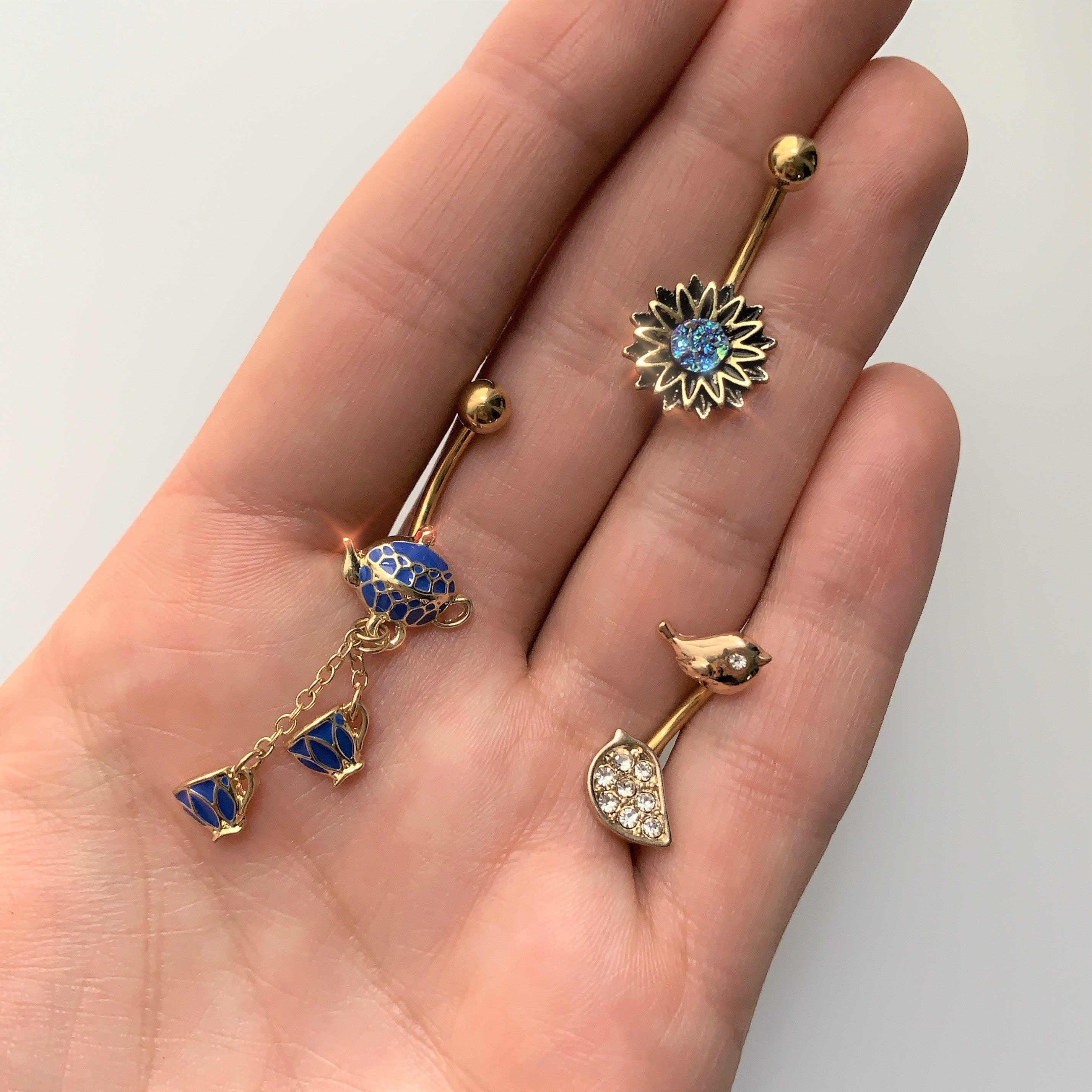 Gold Tone Aqua Center Sunburst Flower Belly Ring